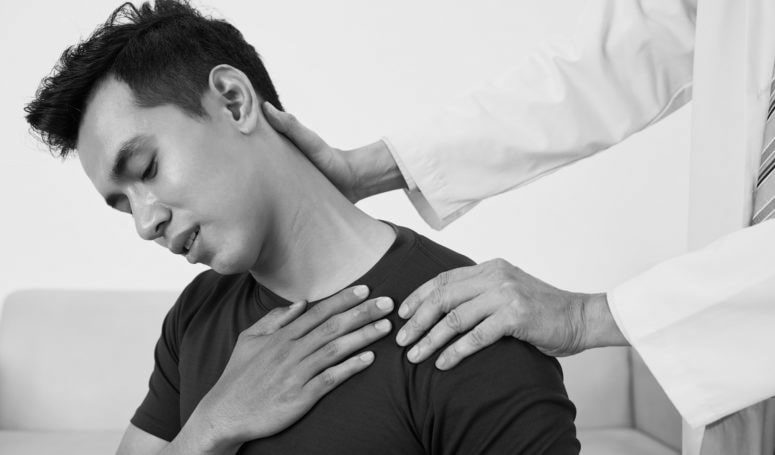 patient suffering from neck pain