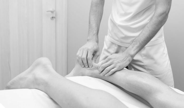 physiotherapist during an achilles tendon treatment